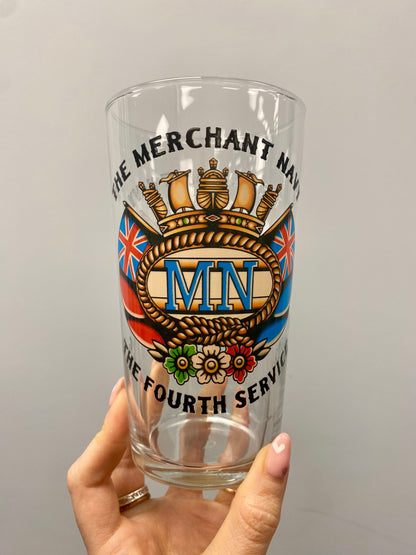 Pint glass, sailor tattoo Merchant Navy badge and swallows